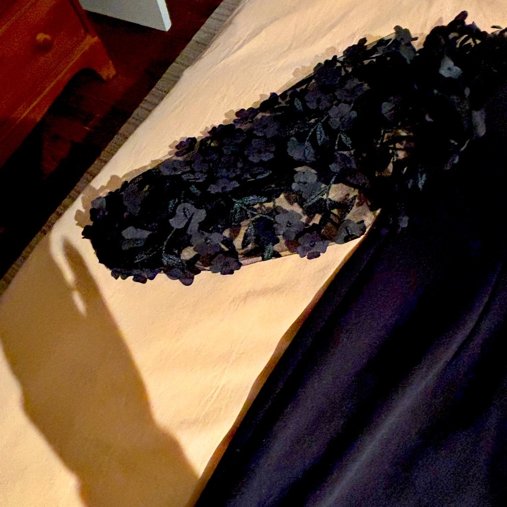 Chic Black Dress with floral appliqué. On sale currently Bloomingdale’s